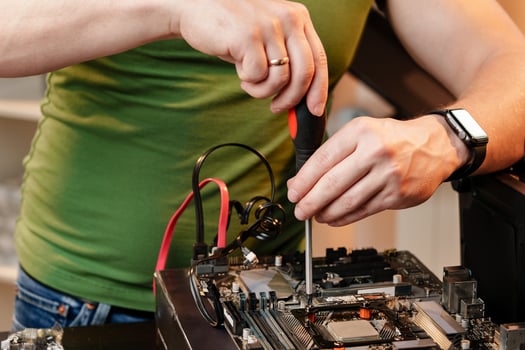 Close up of man repairing computer system unit photo
