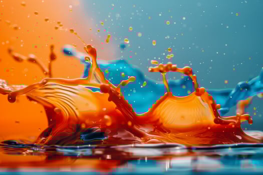 Colorful liquid splash on blue background photo