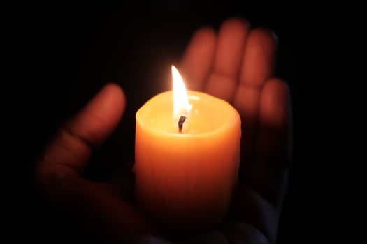 Candlelights soft glow creates a calming ambiance, perfect for meditation or romance photo