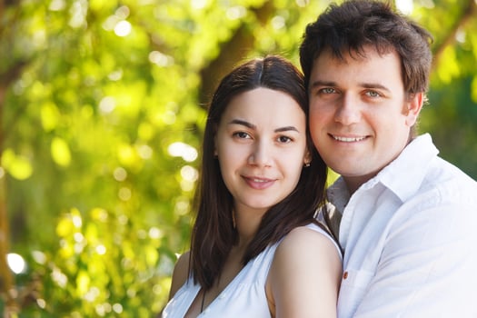 Happy young smiling couple in summer day photo