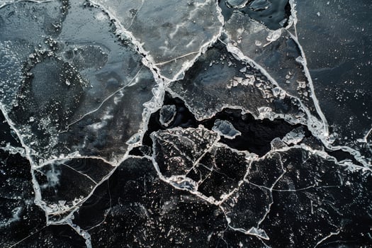 A close up of a cracked ice surface photo