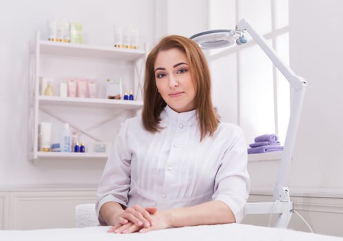 Woman beautician doctor at work in spa center. Portrait of a young female professional cosmetologist. Healthcare occupation, medical career photo