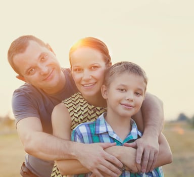 Happy young family with baby girl outdoors photo