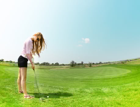 Female golf player at the course photo