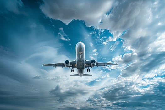 A large passenger jet flying through the sky photo
