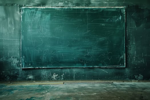 A large green chalkboard is on a wall photo