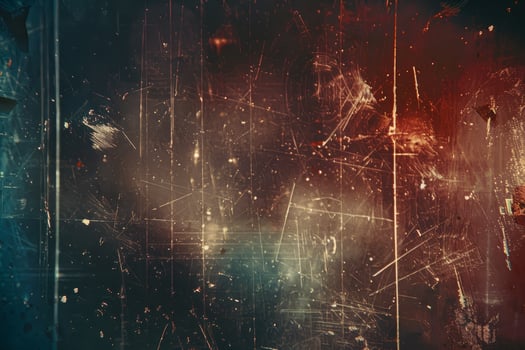 A blurry, grainy, and dirty background with a few red and blue splotches photo