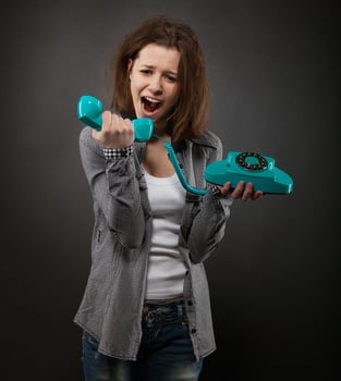 Portrait of the funny girl with old phone photo