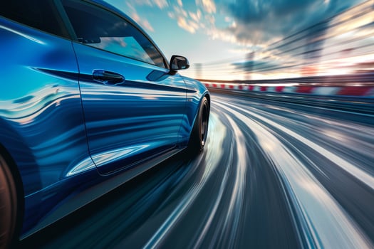 Blue sports car driving on the highway photo