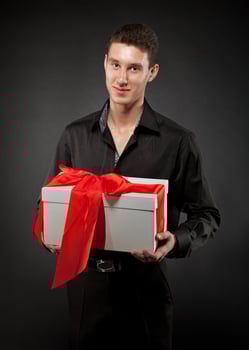 Happy young man with present photo