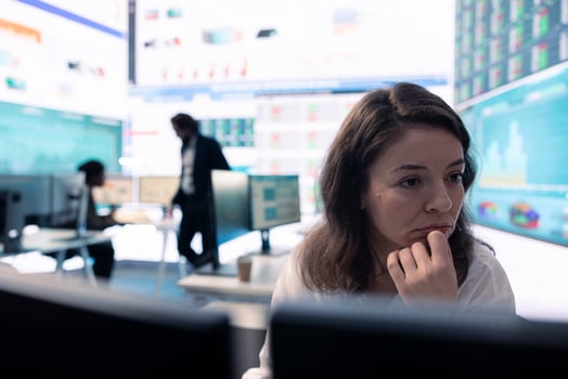 Executive officer analyzing infographics on sales to evaluate supply and demand, find ways of increasing organizational funds and develop the business globally. Strategic objectives. photo