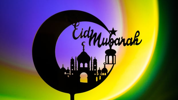Crescent moon with mosque. Traditional Islamic holiday greetings Eid Mubarak. Ramadan Kareem concept background. Creative light and shadows sunset lamp lantern. Islamic holiday poster Eid-Ul-Adha festival celebration photo