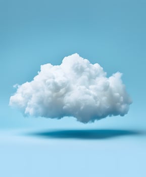 An Isolated Fluffy White Cloud Floating in a Serene Blue Sky photo