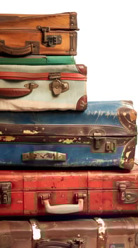 Vintage suitcases on white background for travel and retro themes photo