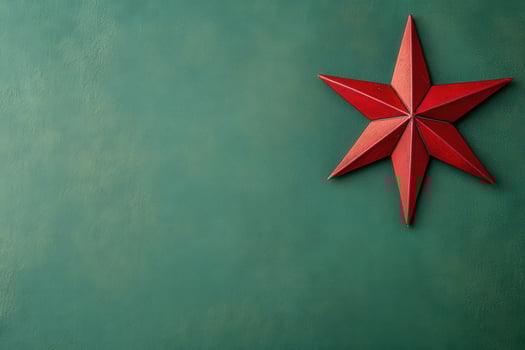 A vibrant red star is placed against a smooth green backdrop, embodying the spirit of Christmas and adding festive charm to the setting. This decoration highlights holiday joy beautifully. photo
