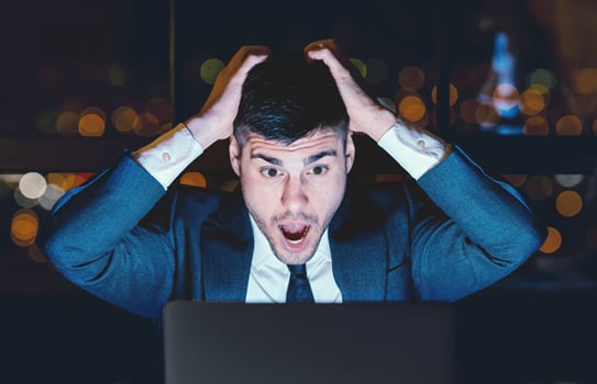 Bad News. Shocked Businessman Shouting Touching Head Looking At Laptop Sitting Overnight In Modern Office. photo