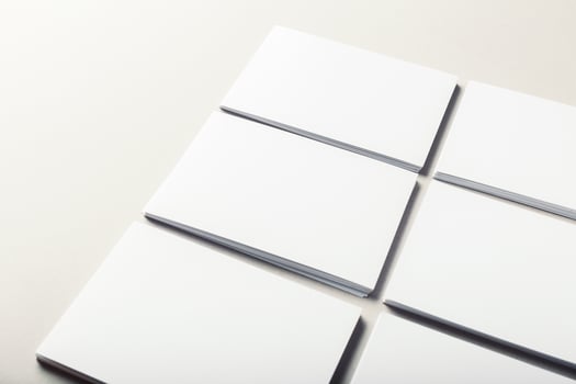blank business cards on grey background photo