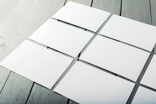 blank business cards on a wooden background photo