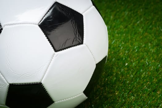 soccer ball on the green field photo