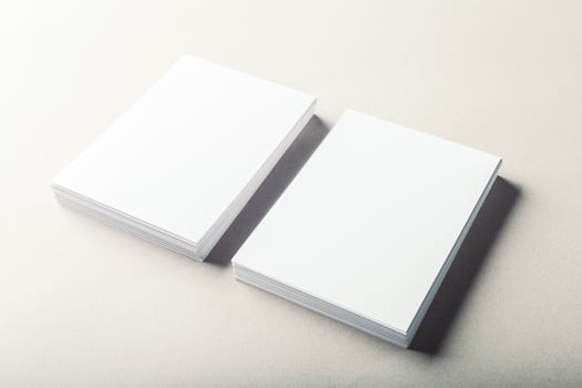 blank business cards on grey background photo