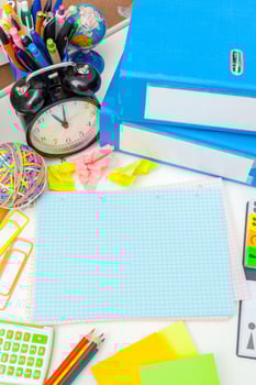 Work place of a creative person with a variety of colorful stationery objects photo