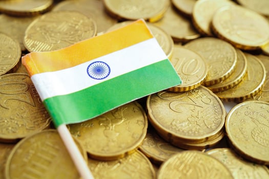 India flag on coin and banknote money, finance trading investment business currency. photo