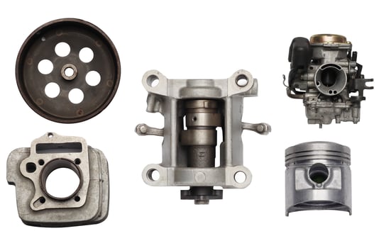 Spare parts of motorcycle scooter piston ,cylinder block, oil filter ,Valve and ball bearings on white background, Flat lay, photo