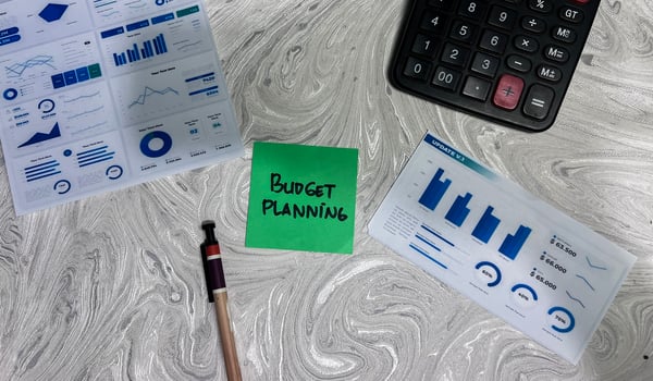 Concept of Budget Planning write on sticky notes isolated on Wooden Table. photo