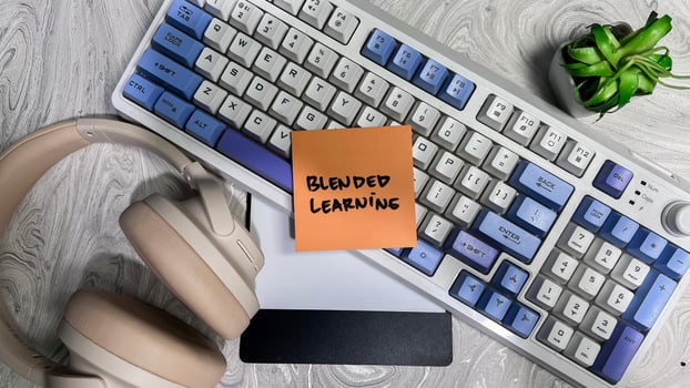 Concept of Blended Learning write on sticky notes isolated on Wooden Table. photo
