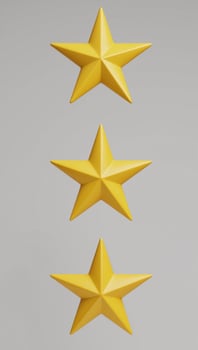 Golden yellow sharppointed stars centered and shining in isolation against a backdrop photo