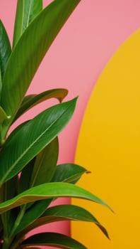 A bright summer scene featuring vibrant tropical foliage against a pinkorangeyellow gradient backdrop photo