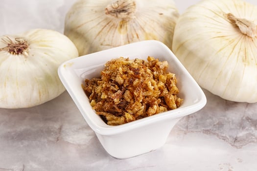 Dried roasted onion flakes for culinary photo