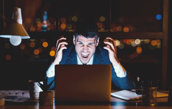 Mad Entrepreneur Man Shouting Angrily Sitting At Laptop Working At Night In Modern Office. Low Light photo