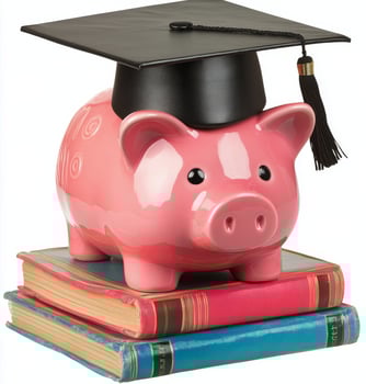 A cheerful piggy bank wearing a graduation cap rests atop a stack of colorful books photo