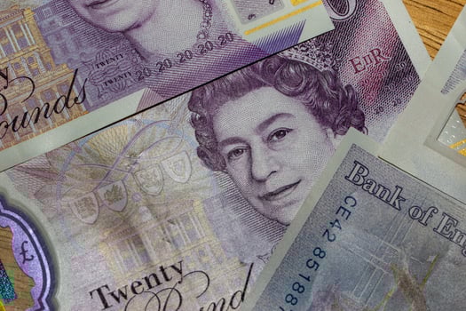 A pile of british currency on a table photo