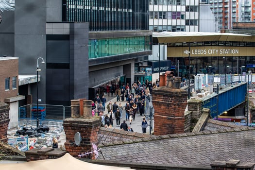 Cityscape View with Rooftops, People, and Station in Leeds photo
