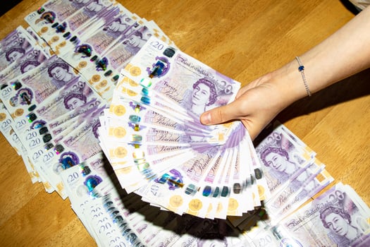 Hand Holding Twenty-Pound Banknotes photo