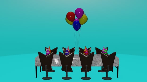 A table with chairs and balloons photo