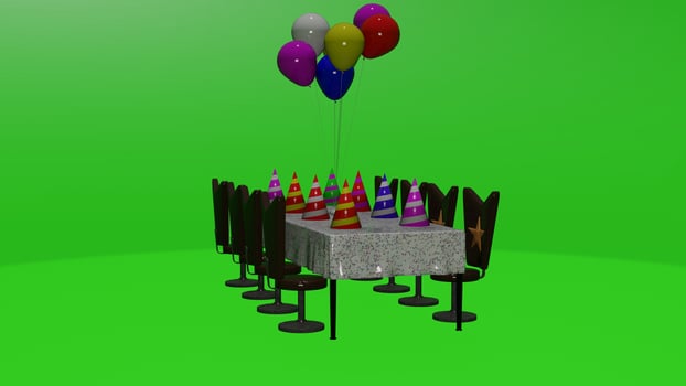 A table with balloons and a birthday cake photo