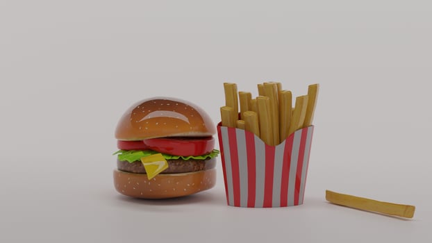 A hamburger and french fries in a paper box photo