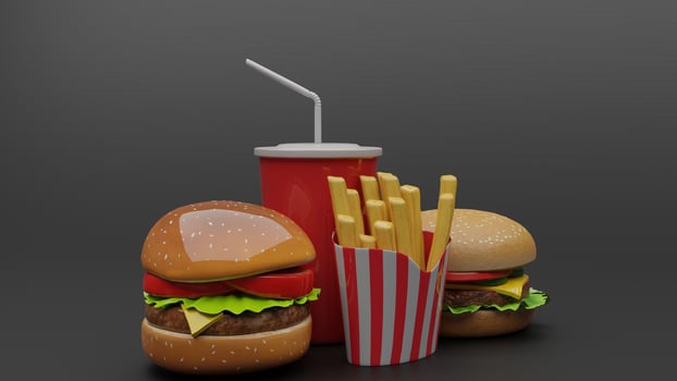 a hamburger and fries on a black background photo