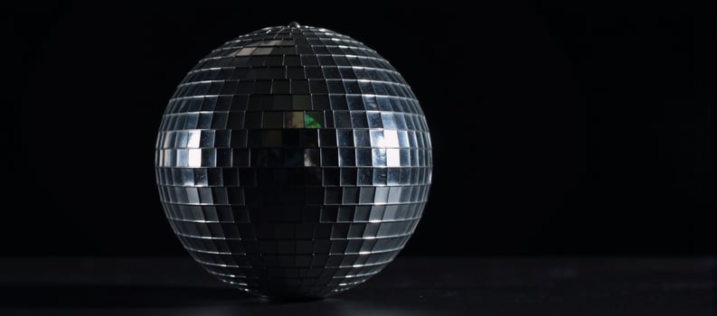 Isolated disco ball against black background photo