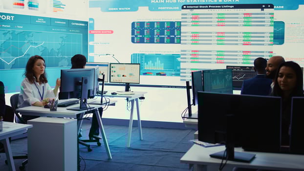 Forecast affiliates working in coworking space office to review latest business news based on performance metrics and progress. Consultants fight to expand the enterprise globally. Camera B. photo