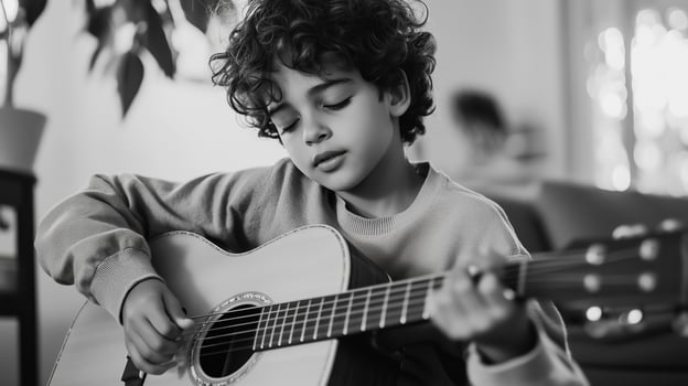 A young boy plays guitar indoors, showcasing his musical talent and passion for music in a cozy living room setting photo