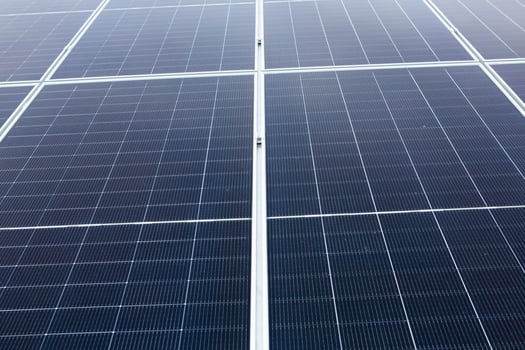 Solar panel on green grass background. Alternative energy source. Solar panel. photo