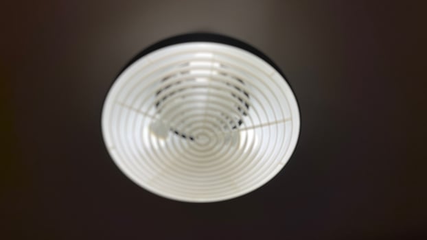 Blurry abstract background of a of Modern Ceiling lamp. Defocused photo background. Perfect for background, design element, or any commercial