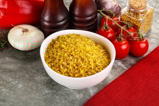 Dry wheat bulgur cereal heap photo