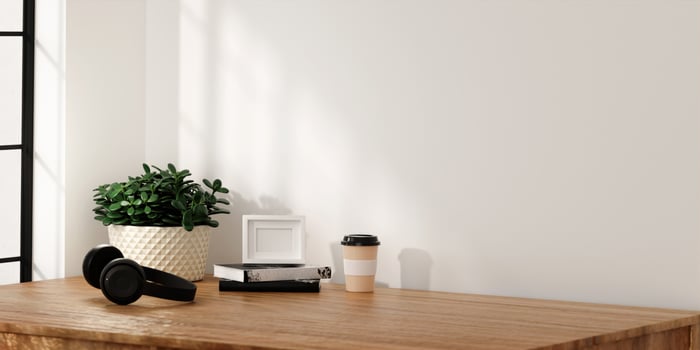 Minimalist Desk Setup with Headphones and Coffee 3D Render photo