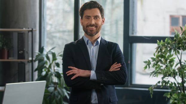Successful confident stylish rich Caucasian business man male entrepreneur businessman leader boss professional employee employer ceo lawyer posing in office looking at camera wellbeing wealth luxury photo