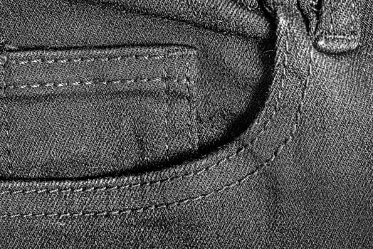 Black jeans pocket as background macro photo. photo